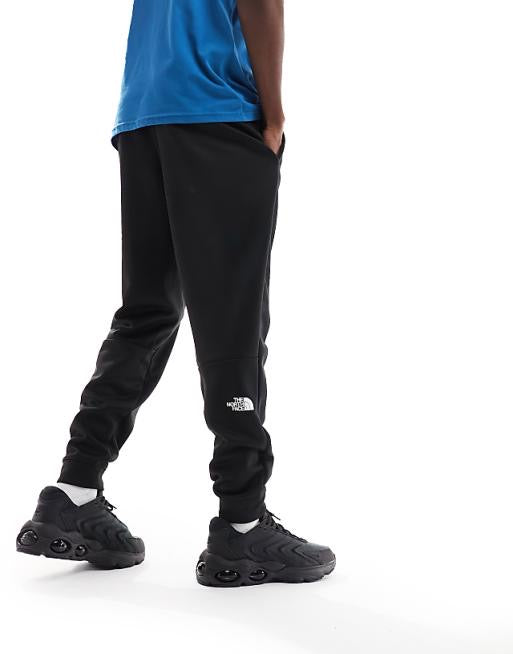 The North Face Training Reaxion fleece joggers in black
