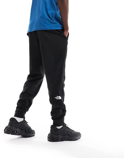 The North Face Training Reaxion fleece joggers in black