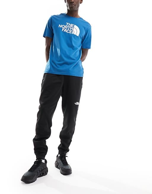 The North Face Training Reaxion fleece joggers in black